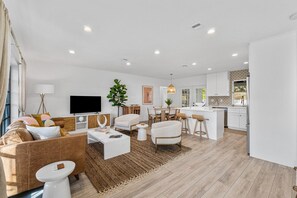 Living room opening to dining area and updated kitchen