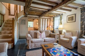Ground floor: Sitting room with wood burning stove and slate floor