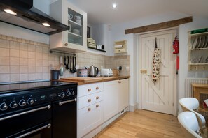 Ground floor:  Kitchen with range cooker and small breakfast table