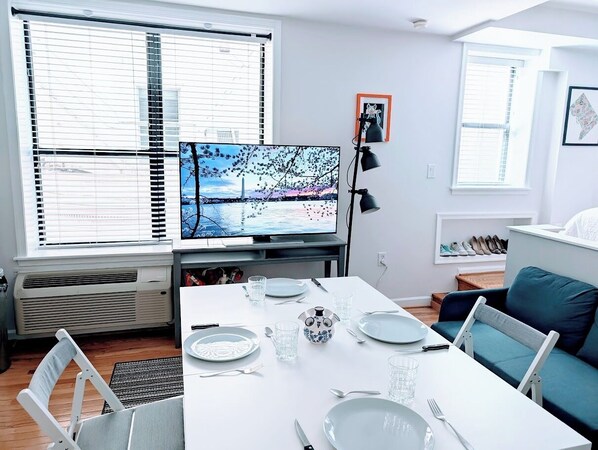 Dining Room table with seating for 4. Large screen TV available via google cast.