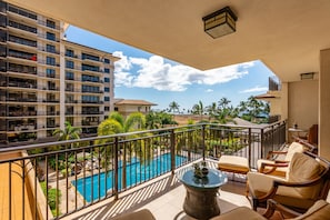 Private balcony/Lanai with ocean and pool views.