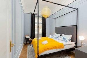 Pastel chic bedroom with double bed.
