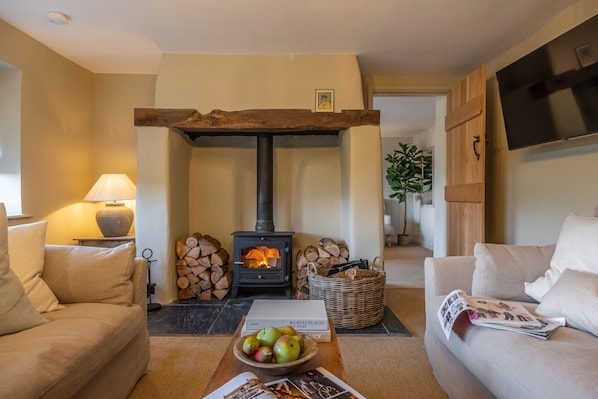 Evergreen, Thornage: Cosy sitting room with wood burning stove