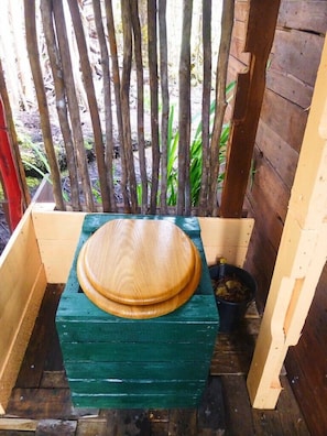 Indoor/outdoor composting toilet.