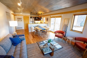 Great Room: Kit, dining, living room w/deck & panoramic river views.