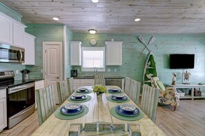 The dining table seats 8 and the kitchen is stocked with everything you would need to cook your catch of the day.