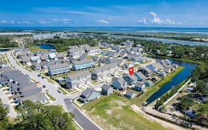 Aerial showing pond behind home, Taylors creek and the Bogue Sound in background