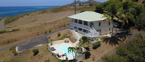 Drone shot of house and pool looking east.