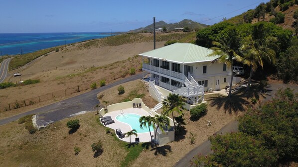 Drone shot of house and pool looking east.