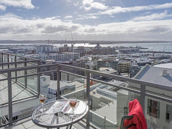 enjoy a glass of wine overlooking Aucklands stunning views