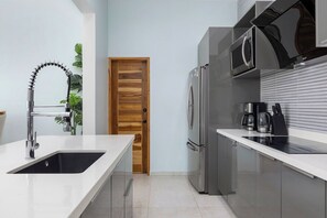 Cook up your favorite meals in our fully equipped kitchen — complete with modern appliances and everything you need for a comfortable stay!