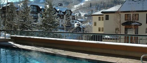 Pool deck is fully visibly from unit's private patio!