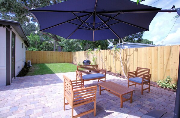 Privately fenced back yard with pavered patio 