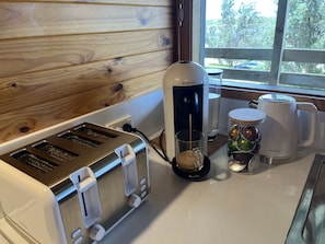 Nespresso machine and coffee pods.