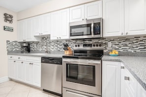 The kitchen is fully stocked and ready for any cooking or cocktailing endeavor.