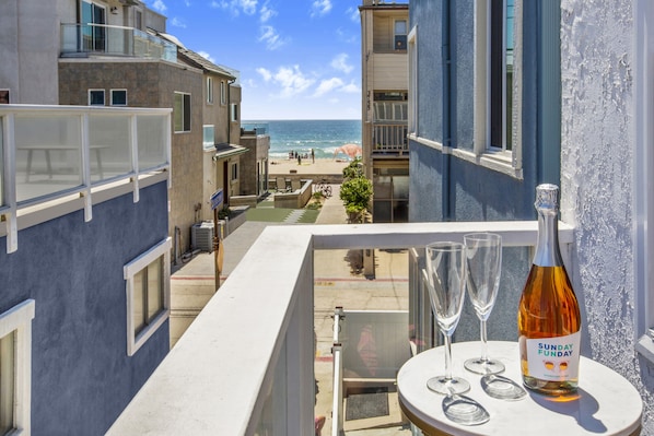 Treat yourself to some Rosé while watching the surfers catch some waves