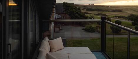 Seating area with views of New Slains Castle and Cruden Bay Golf Club from the upper balcony