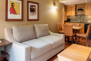 Sink back on the comfortable sofa in the bright seating area.