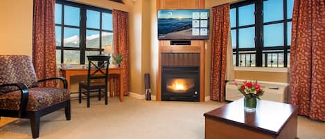 Relax in front of the fireplace in our cozy and deluxe mountain condo!