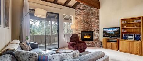 Living room with Smart TV, DVD player, and gas fireplace