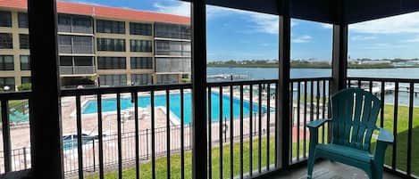 View of the intercoastal water of Indian Shores and the heated p - View of the intercoastal water of Indian Shores and the heated pool and hot tub from the screened in balcony off this unit.