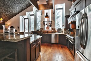 French door refrigerator in the kitchen, 6 casement windows