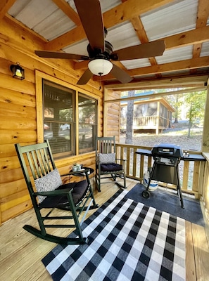 Settle in with a glass of wine on screened in front porch. Gas grill too