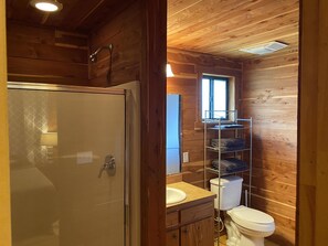 Full bathroom with hot water shower.