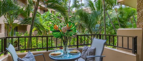 Dine al fresco with a mai tai while enjoying the private, lush garden views