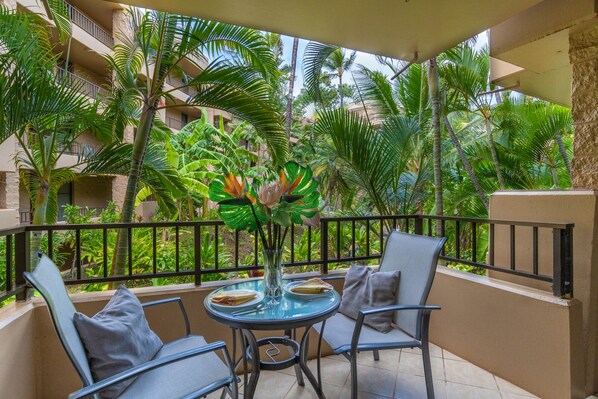 Dine al fresco with a mai tai while enjoying the private, lush garden views