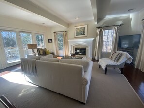 Spacious bright living room for entertaining--note new white couch.