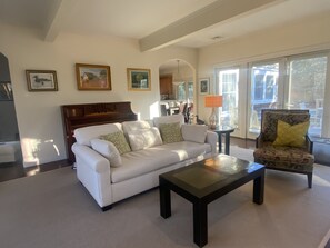 Open floor plan on first level with piano