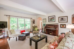 Livingroom with great light; piano.  (Green sofa was replaced white couch)