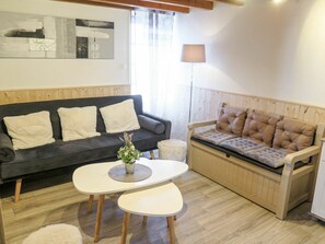 Table, Couch, Property, Furniture, Comfort, Azure, Living Room, Wood, Studio Couch, Lighting