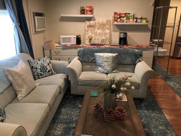 The living room with a coffee and tea section always stocked.