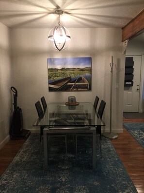 Dining table with four chairs.