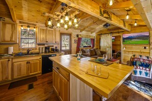 Large Butcher Block Island and Kitchen Open to the Living & Dining Family Areas