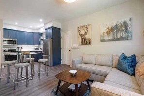 Living Room Opens to Dining Area & Kitchen