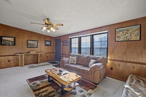 Discover the heart of our cabin in the living room – a rustic haven where warmth and character unite, offering a cozy retreat for moments of relaxation and connection. 🌲🛋️ #RusticLiving #CabinEscape