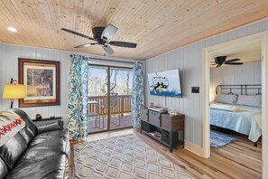 Flow of Comfort: Step from the welcoming living room onto the outdoor deck seamlessly, where indoor comfort merges with the tranquility of the open air.
