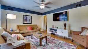 Large living room with 2 sleeper sofas and flat screen TV complete with Roku.