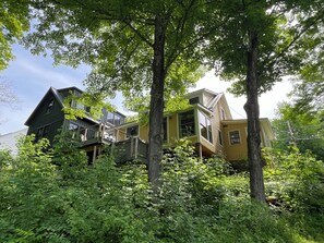 Rear of house hangs out over the cliff at the Mad River 