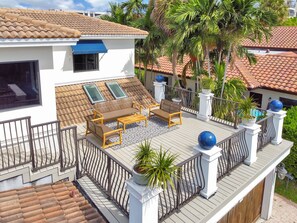 Roof deck with and comfy chairs, perfect for a sunset cocktail or family gathering photo