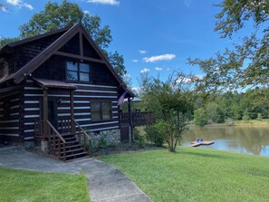 Authentic log cabin located on a 5 acre pond with private dock. 