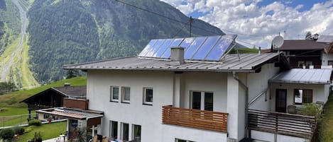 Cloud, Plant, Sky, Building, Property, Window, Mountain, House, Vegetation, Land Lot