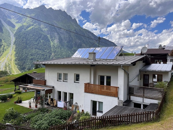 Cloud, Plant, Sky, Building, Property, Window, Mountain, House, Vegetation, Land Lot