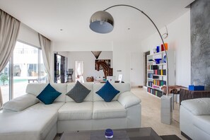 Bright and spacious living room with comfortable seating. 