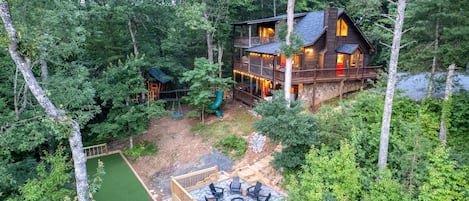 Welcome to your two acres of secluded mountain paradise. You have your main cabin in the trees with its own magical treehouse for kids and adults.