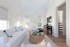 LIVING AREA WITH VIEW UP TO THIRD FLOOR LOFT