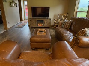 Living Room with electric fireplace and 55" Smart TV